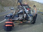 Bike lifted on tow truck.jpg
