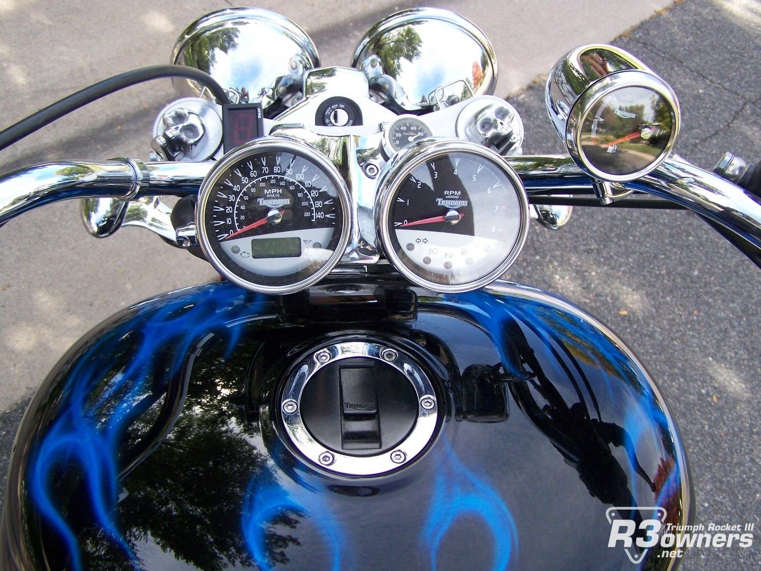 Instrument cluster with small skulls and cool blue paint