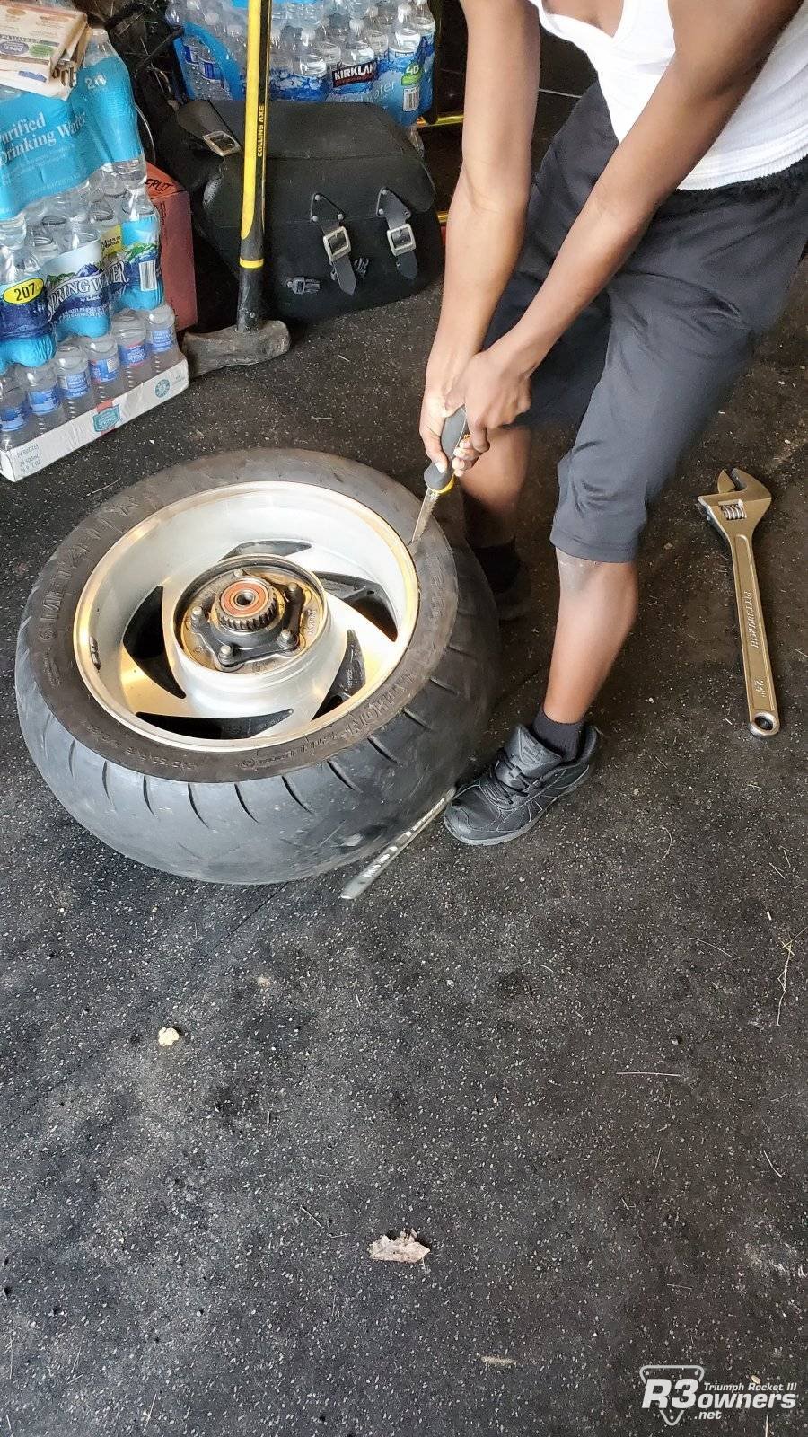 My Son removing the rear tire from the wheel